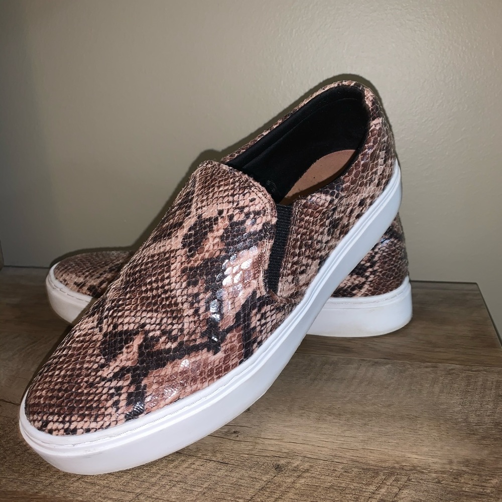 Slip on snake print shoes